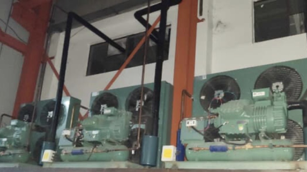 Older copper-coil condensing units in a compressor room