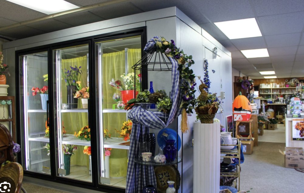 Floral walk-in cooler with glass display doors in a flower shop