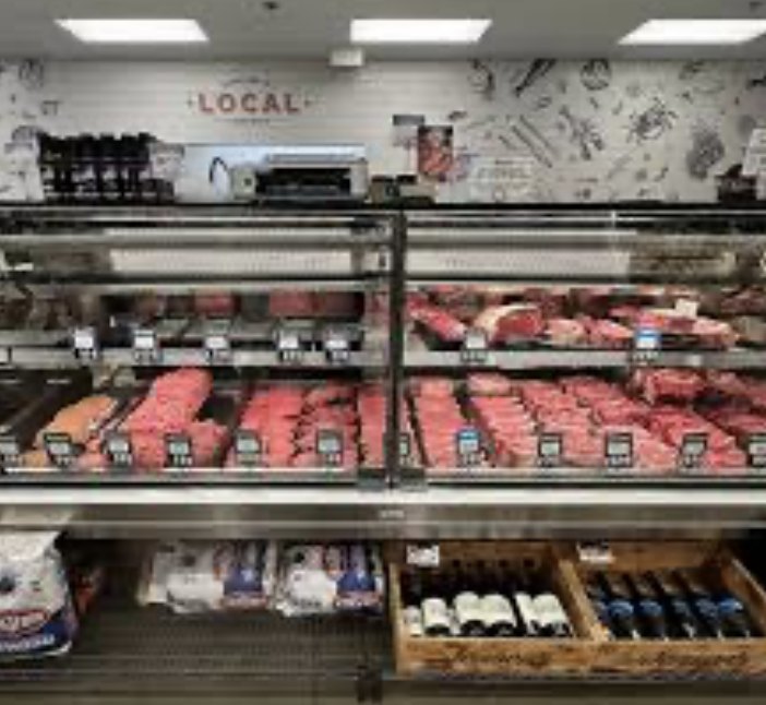 Fresh red meat in a butcher display case