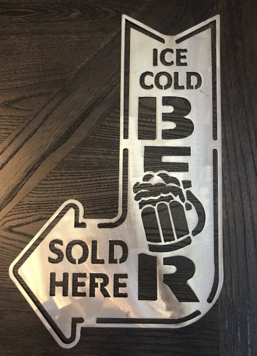Ice Cold Beer Sold Here sign at a liquor store