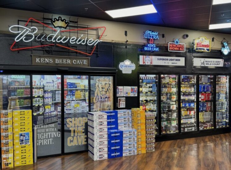 Liquor store storefront beer cave with reach-in glass doors and stacked cases