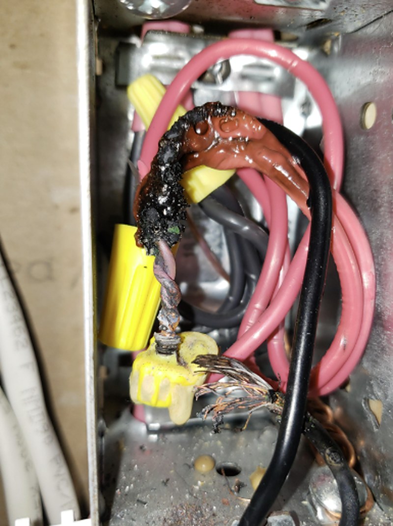 Melted low-voltage AC wiring from a bypassed fuse