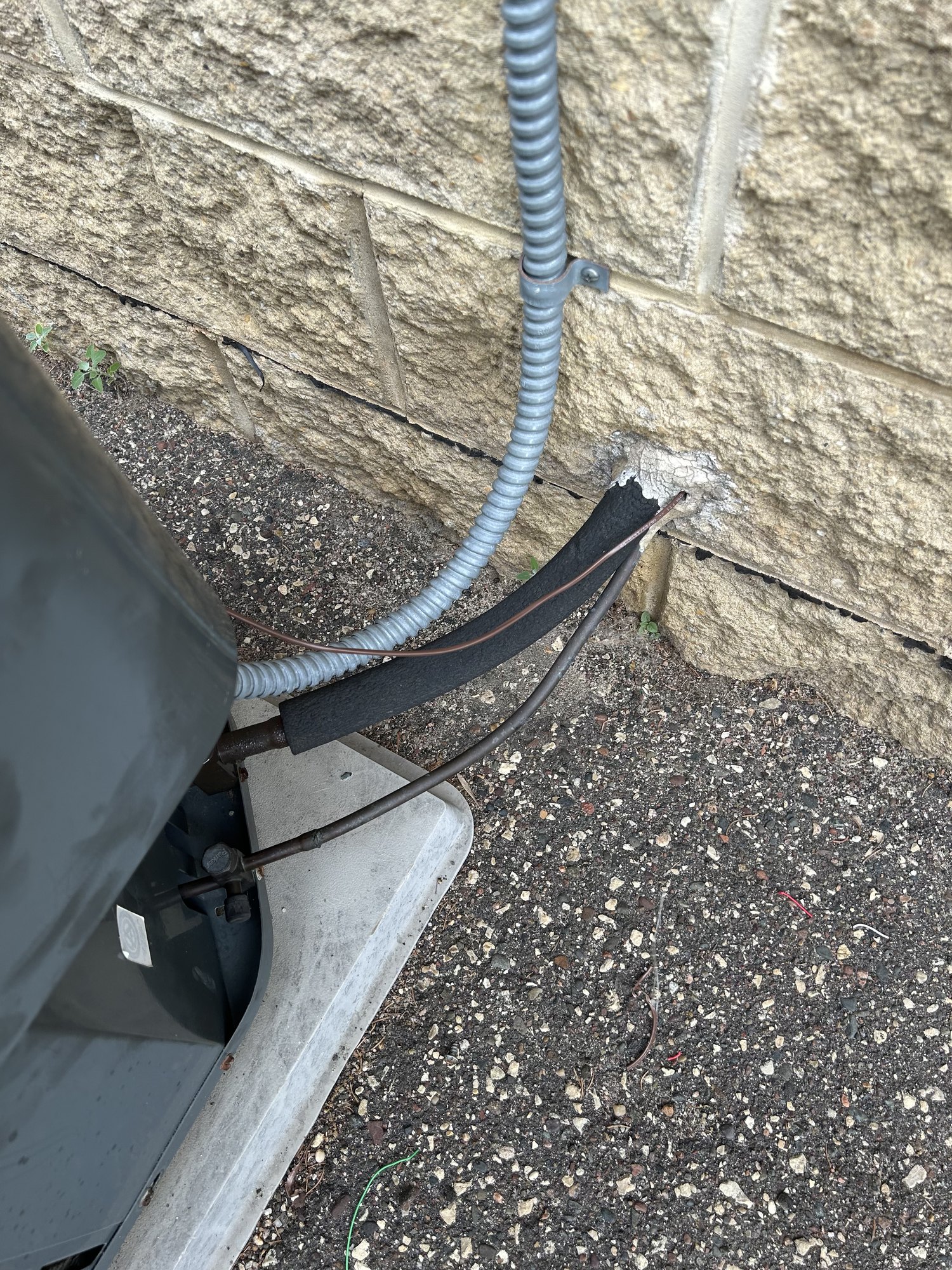 A fresh thermostat-wire run to the condenser, routed and protected so it won’t short out again.